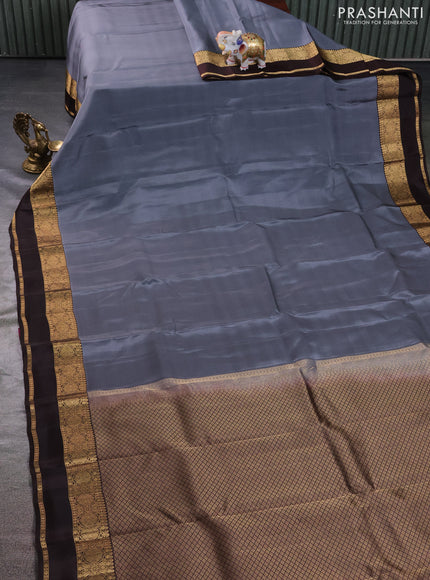 Kanchipuram silk saree grey and brown with plain body and rettapet zari woven border