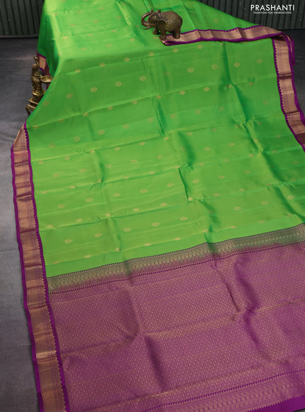 Kanchipuram silk saree parrot green and purple with zari woven buttas and zari woven korvai border