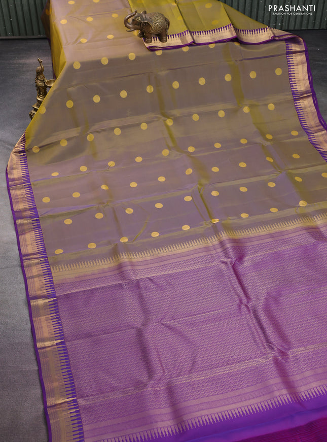 Kanchipuram silk saree dual shade of green and violet with zari woven geometric buttas and temple design zari woven border