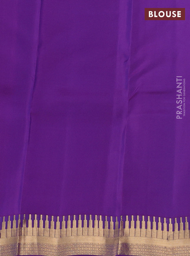 Kanchipuram silk saree dual shade of green and violet with zari woven geometric buttas and temple design zari woven border