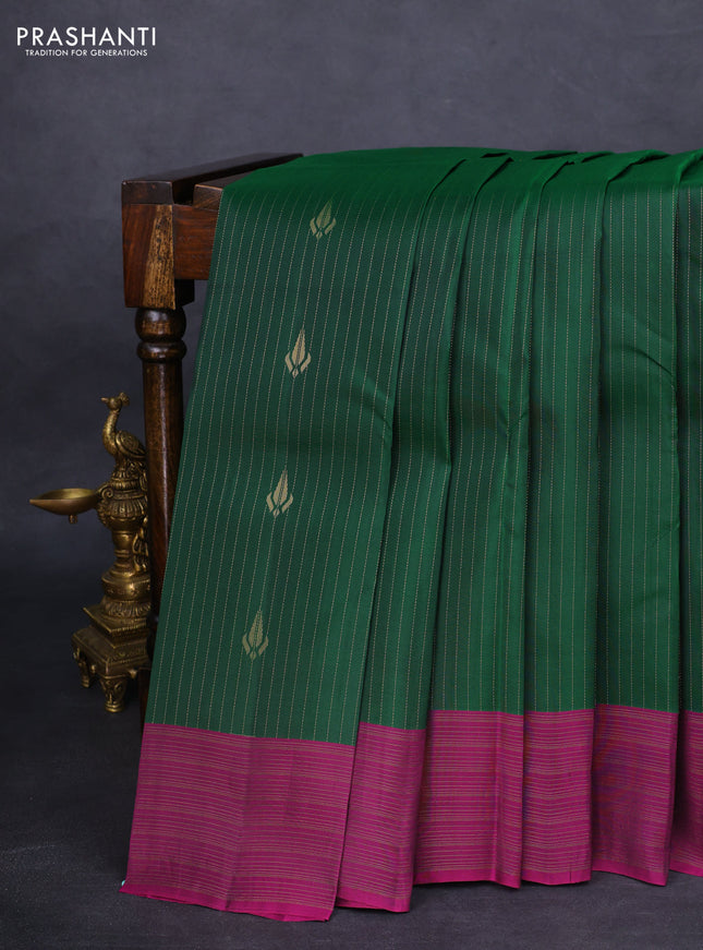 Kanchipuram silk saree dark green and purple with allover zari weaves and zari woven border