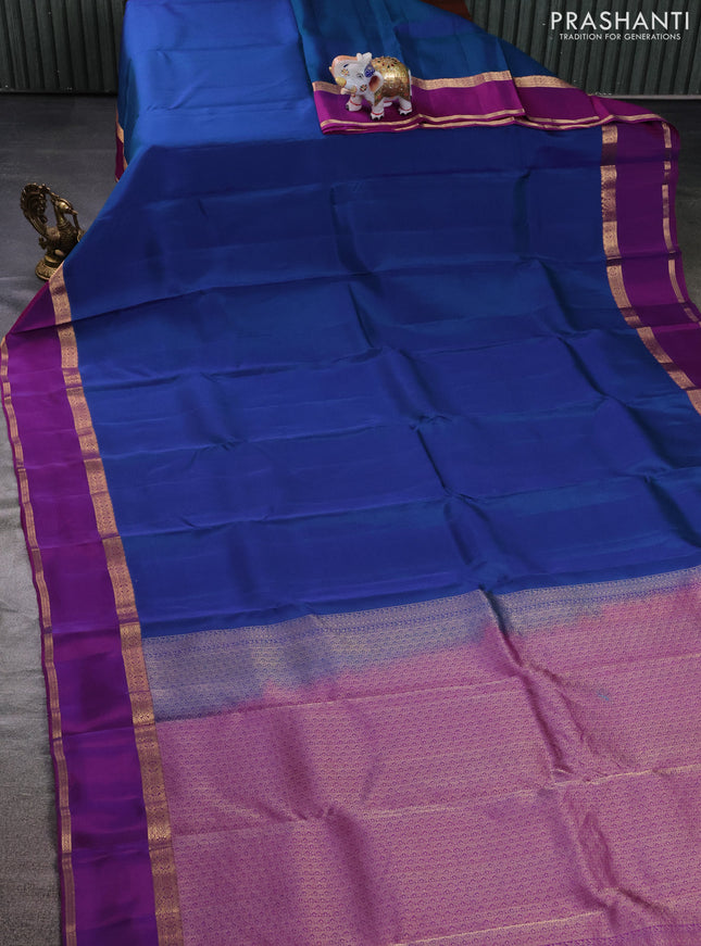 Kanchipuram silk saree dual shade of bluish green and purple with plain body and rettapet zari woven border