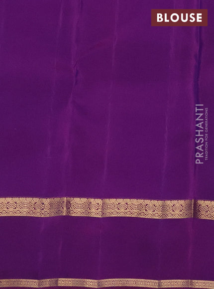 Kanchipuram silk saree dual shade of bluish green and purple with plain body and rettapet zari woven border