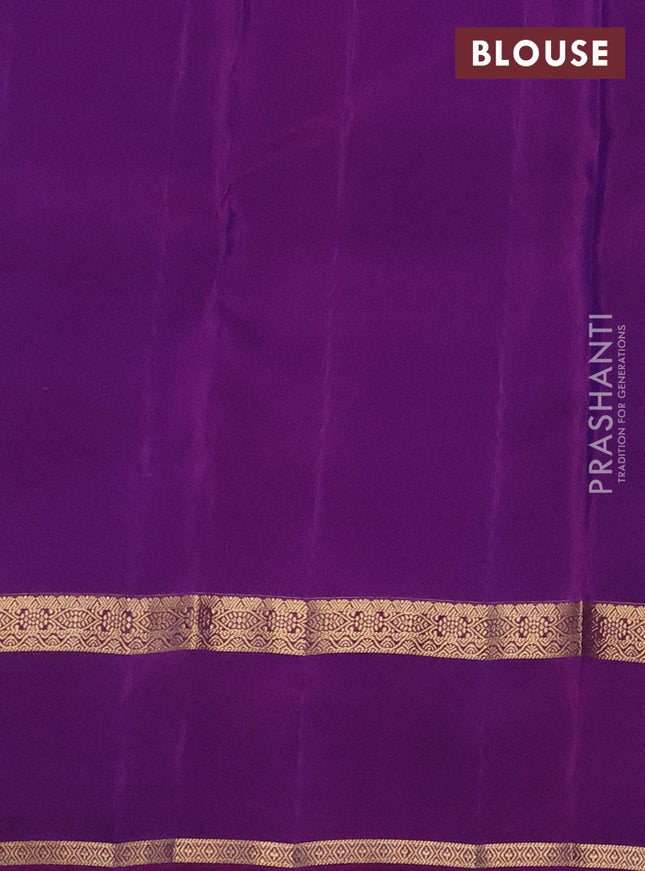 Kanchipuram silk saree dual shade of bluish green and purple with plain body and rettapet zari woven border