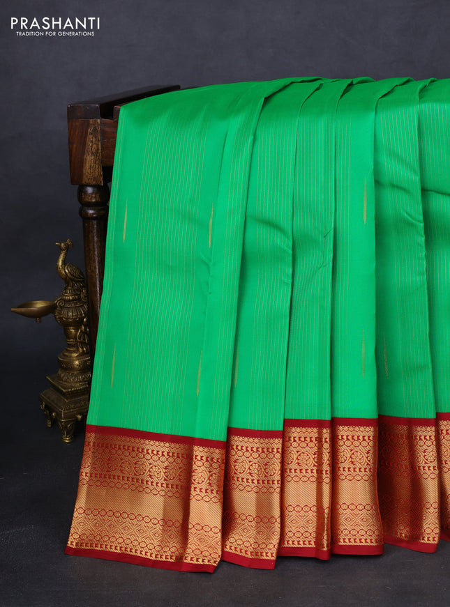 Kanchipuram silk saree green and maroon with allover zari weaves & buttas and zari woven korvai border