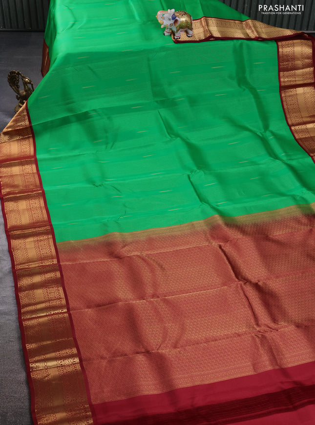 Kanchipuram silk saree green and maroon with allover zari weaves & buttas and zari woven korvai border