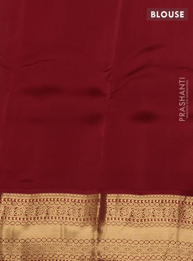 Kanchipuram silk saree green and maroon with allover zari weaves & buttas and zari woven korvai border