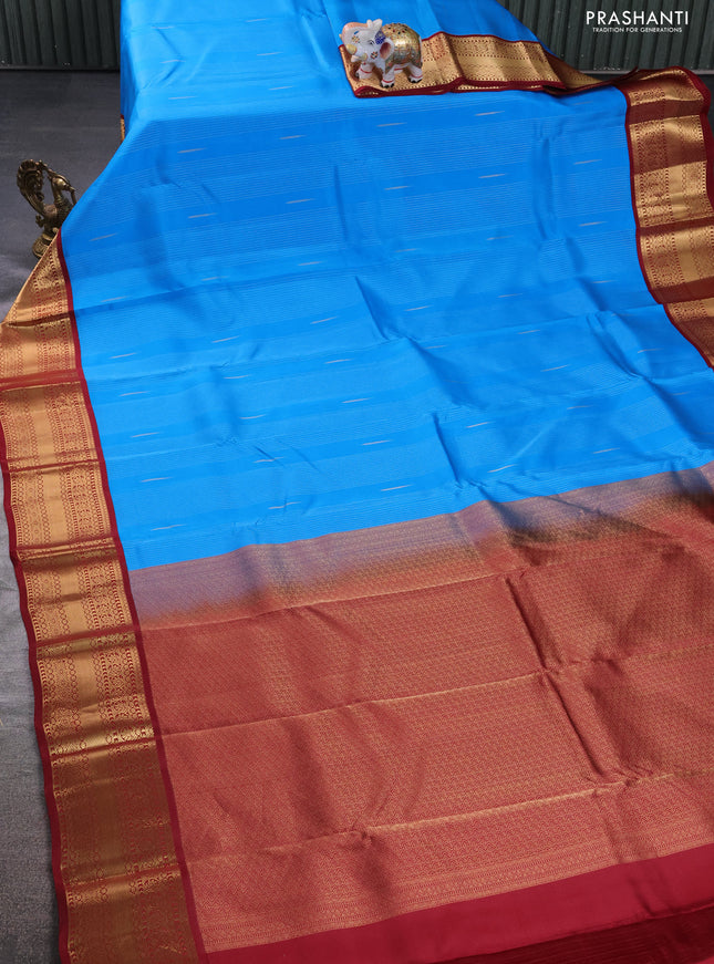 Kanchipuram silk saree cs blue and maroon with allover zari weaves & buttas and zari woven korvai border