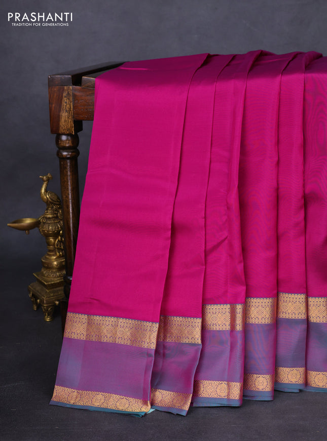 Kanchipuram silk saree purple and dual shade of teal green with plain body and rettapet zari woven border