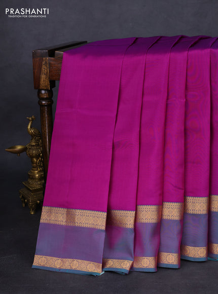 Kanchipuram silk saree purple and dual shade of teal green with plain body and rettapet zari woven border