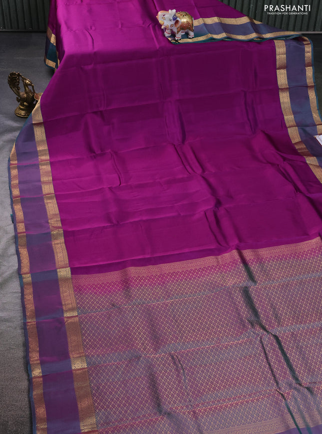 Kanchipuram silk saree purple and dual shade of teal green with plain body and rettapet zari woven border