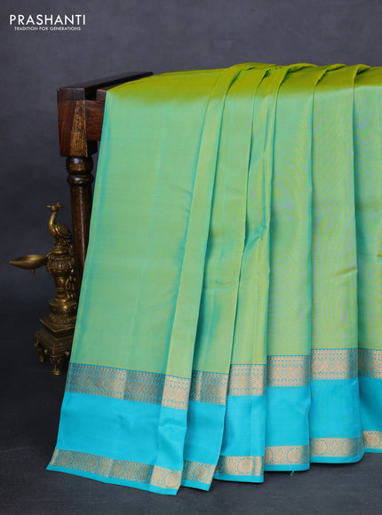 Kanchipuram silk saree dual shade of teal green and teal blue with plain body and rettapet zari woven border