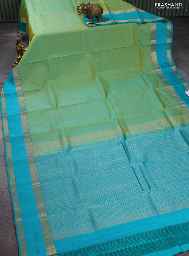 Kanchipuram silk saree dual shade of teal green and teal blue with plain body and rettapet zari woven border
