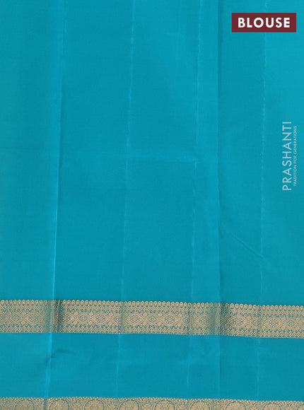 Kanchipuram silk saree dual shade of teal green and teal blue with plain body and rettapet zari woven border