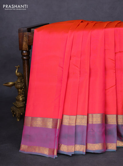 Kanchipuram silk saree dual shade of pinkish orange and dual shade of teal green with plain body and rettapet zari woven border