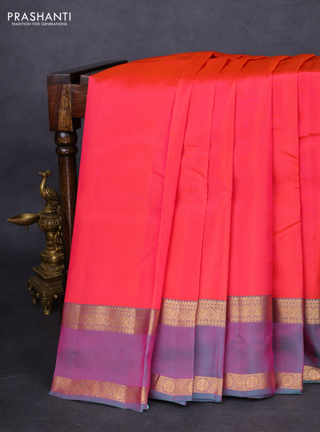 Kanchipuram silk saree dual shade of pinkish orange and dual shade of teal green with plain body and rettapet zari woven border