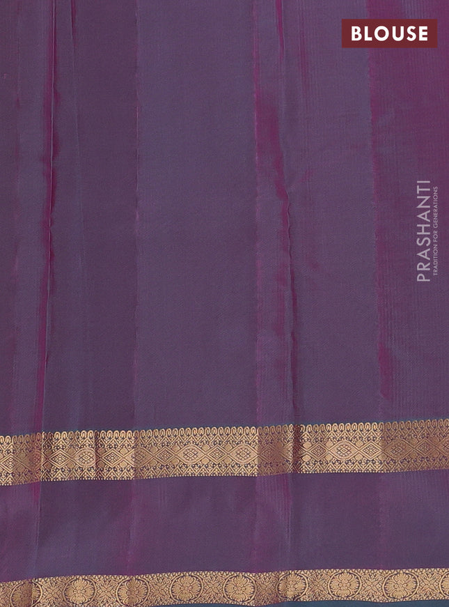 Kanchipuram silk saree dual shade of pinkish orange and dual shade of teal green with plain body and rettapet zari woven border