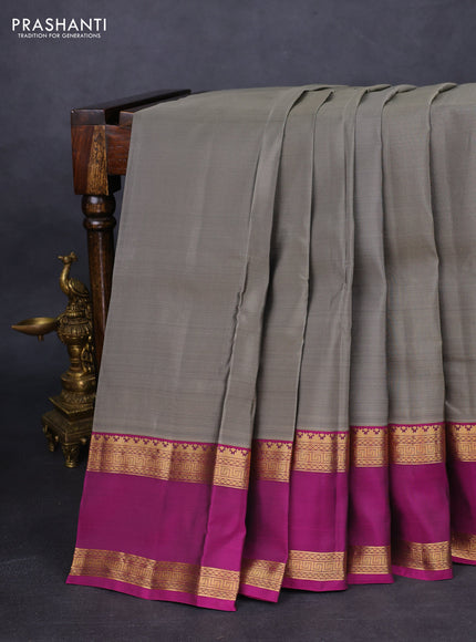 Kanchipuram silk saree grey and purple with plain body and rettapet zari woven border