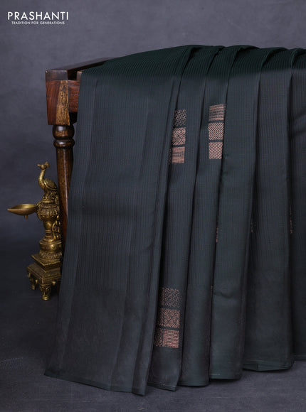 Kanchipuram silk saree dark bottle green and dual shade of pinkish orange with allover self emboss and zari butta border