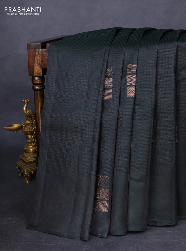 Kanchipuram silk saree dark bottle green and dual shade of pinkish orange with allover self emboss and zari butta border