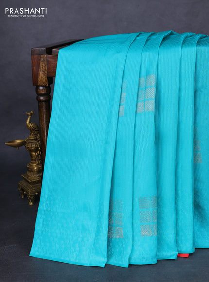 Kanchipuram silk saree teal blue and dual shade of pinkish orange with allover self emboss and zari butta border