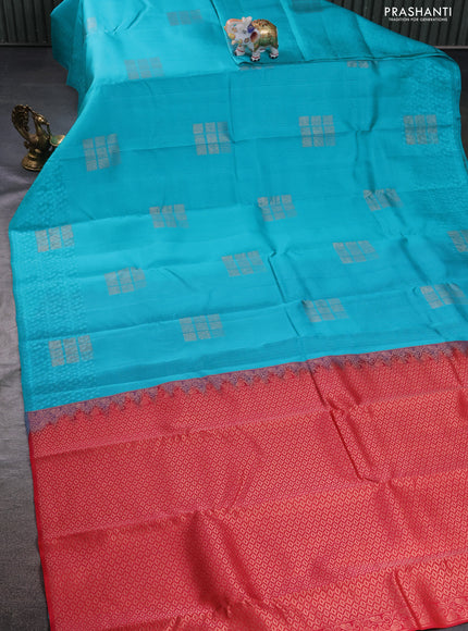 Kanchipuram silk saree teal blue and dual shade of pinkish orange with allover self emboss and zari butta border