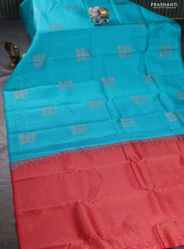 Kanchipuram silk saree teal blue and dual shade of pinkish orange with allover self emboss and zari butta border