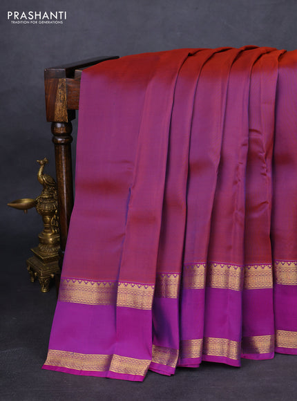 Kanchipuram silk saree dual shade of maroon and purple with plain body and rettapet zari woven border