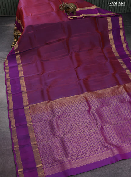Kanchipuram silk saree dual shade of maroon and purple with plain body and rettapet zari woven border