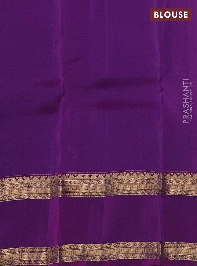 Kanchipuram silk saree dual shade of maroon and purple with plain body and rettapet zari woven border