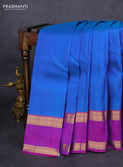 Kanchipuram silk saree cs blue and purple with plain body and rettapet zari woven border