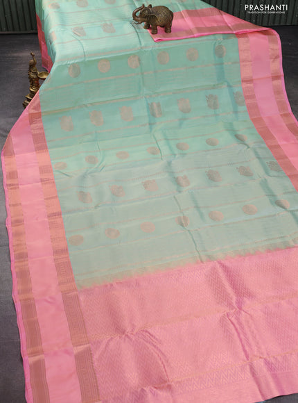 Kanchipuram silk saree pastel green and peach pink with allover copper zari weaves and rettapet copper zari woven border