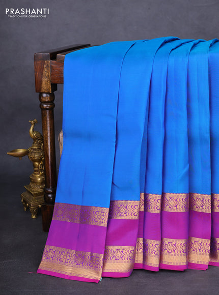 Kanchipuram silk saree dual shade of blue and purple with plain body and rettapet zari woven border
