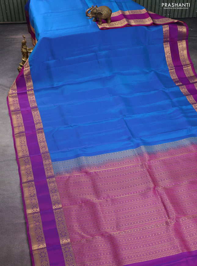 Kanchipuram silk saree dual shade of blue and purple with plain body and rettapet zari woven border