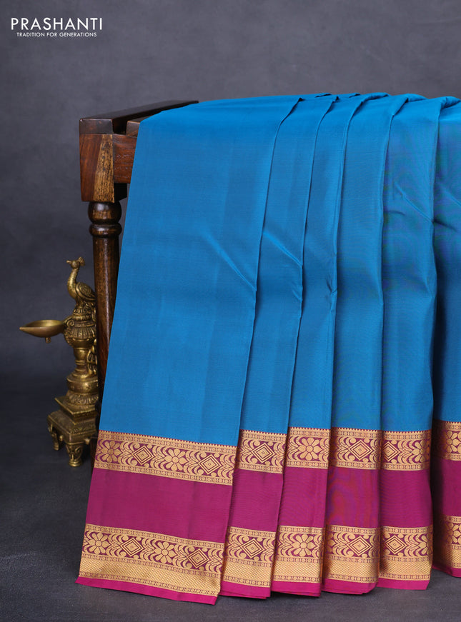 Kanchipuram silk saree peacock blue and purple with palin body and rettapet zari woven border