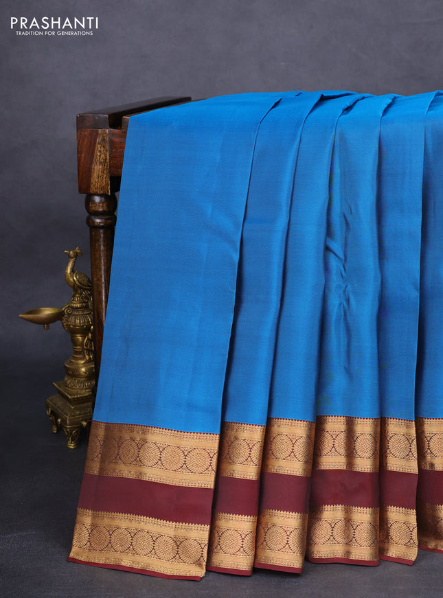 Kanchipuram silk saree cs blue and deep maroon with palin body and rettapet zari woven border