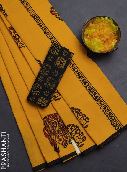 Semi silk cotton saree mango yellow and black with elephant butta prints and piping border