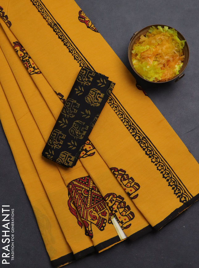Semi silk cotton saree mango yellow and black with elephant butta prints and piping border