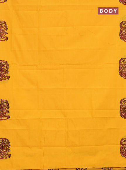 Semi silk cotton saree mango yellow and black with elephant butta prints and piping border
