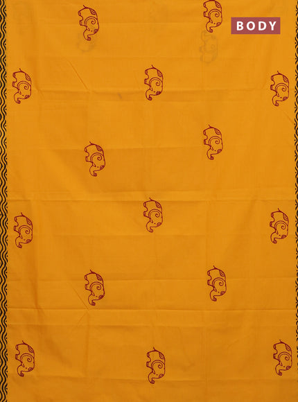 Semi silk cotton saree mango yellow and maroon with elephant butta prints and printed border