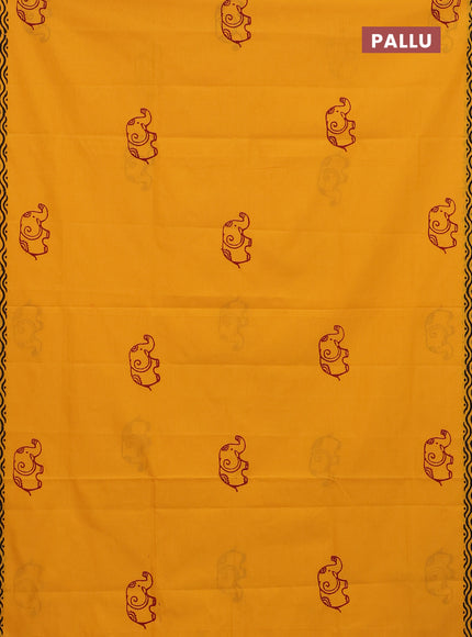 Semi silk cotton saree mango yellow and maroon with elephant butta prints and printed border