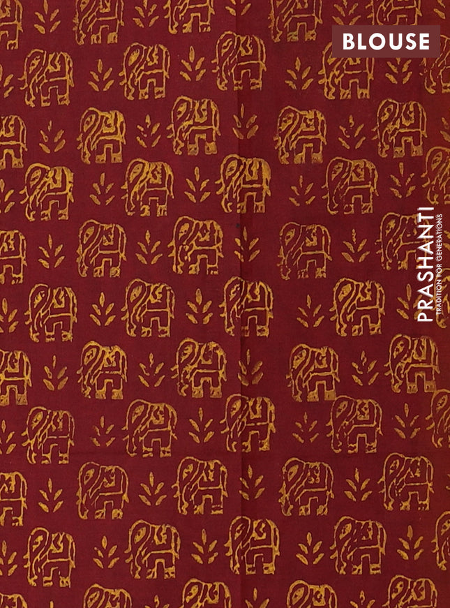 Semi silk cotton saree mango yellow and maroon with elephant butta prints and printed border