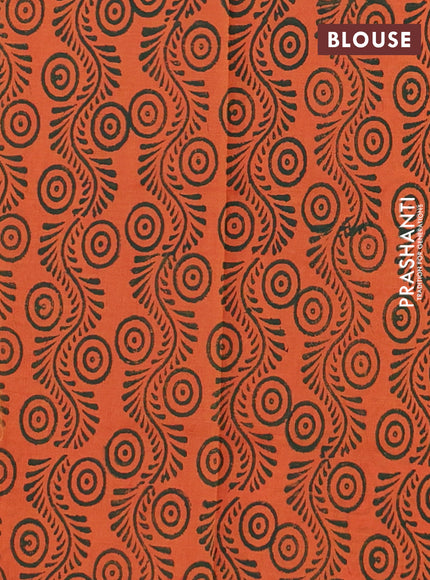 Semi silk cotton saree green and peach orange with butta prints in borderless style