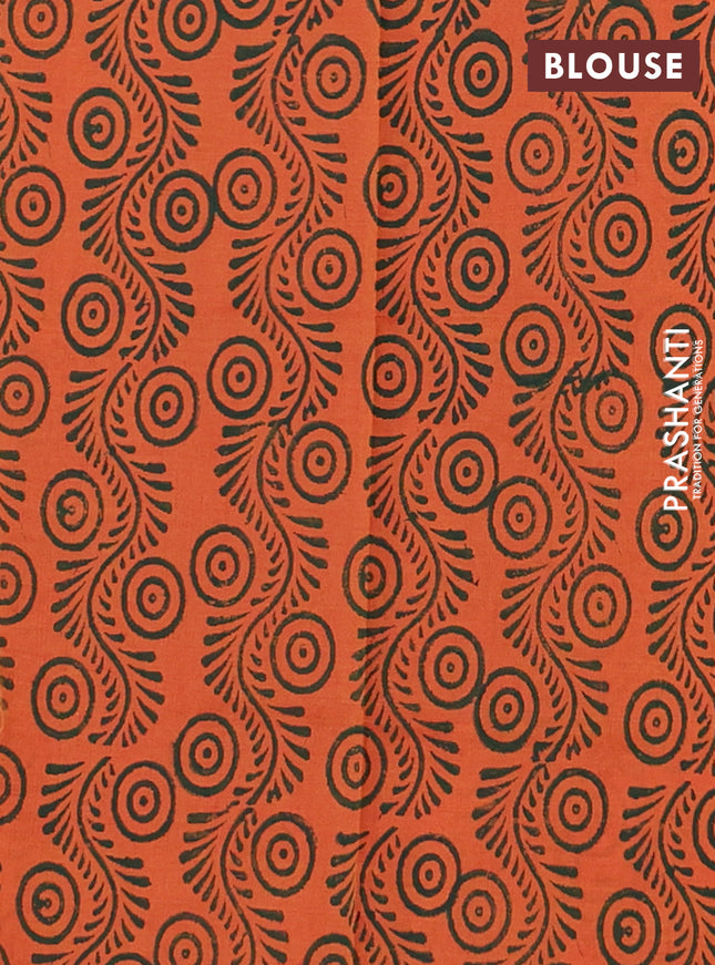 Semi silk cotton saree green and peach orange with butta prints in borderless style