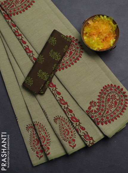 Semi silk cotton saree pista green and brown with butta prints and printed border