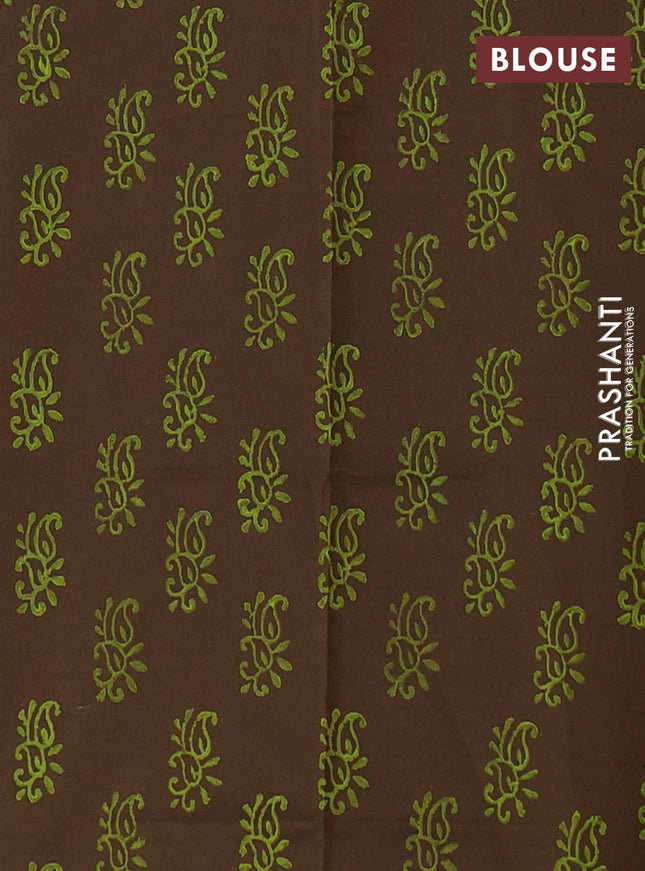 Semi silk cotton saree pista green and brown with butta prints and printed border