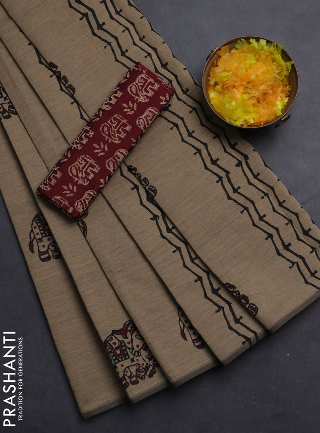 Semi silk cotton saree beige and maroon with elephant butta prints in borderless style