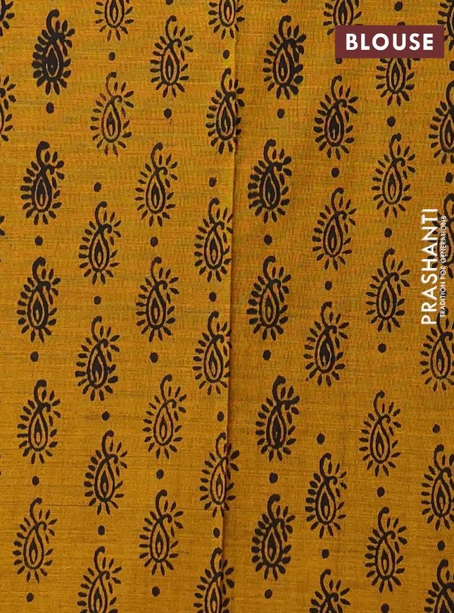 Semi silk cotton saree black and mustard shade with embroided buttas in borderless style