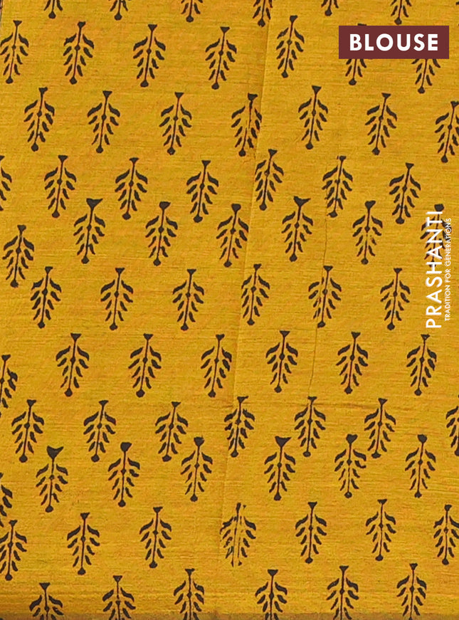 Semi silk cotton saree black and mustard shade with embroided buttas in borderless style