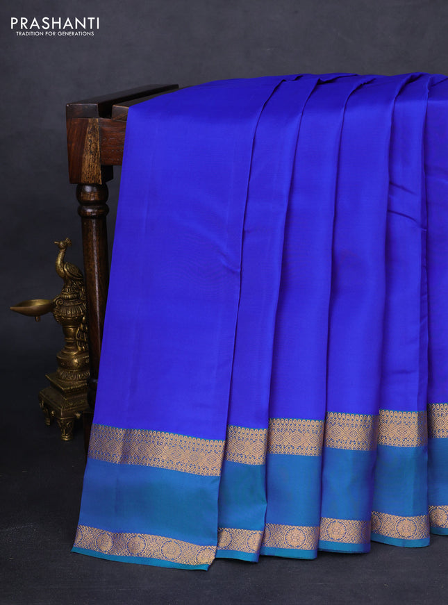 Kanchipuram silk saree blue and dual shade of teal green with plain body and rettapet zari woven border